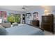 Bedroom with comfortable sitting area, large windows to the lush landscape, and plenty of storage at 4464 46Th S Ave, St Petersburg, FL 33711