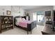 Cozy bedroom with vintage furniture, carpet and access to an outdoor patio at 4464 46Th S Ave, St Petersburg, FL 33711