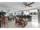Bright dining room with kitchen view features mirror wall and ceiling fan at 4464 46Th S Ave, St Petersburg, FL 33711
