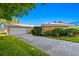 Charming single Gathering home featuring a well-maintained lawn and a long driveway to the attached garage at 4464 46Th S Ave, St Petersburg, FL 33711