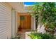 Charming front entrance with a double door, a wreath, and surrounded by lush greenery at 4464 46Th S Ave, St Petersburg, FL 33711