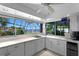 Light-filled kitchen offers a sink with views of the water and surrounding landscape at 4464 46Th S Ave, St Petersburg, FL 33711