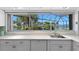 Bright kitchen featuring white countertops and a window overlooking the water at 4464 46Th S Ave, St Petersburg, FL 33711