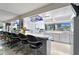 Eat-in kitchen with counter seating, white cabinetry, and waterfront views at 4464 46Th S Ave, St Petersburg, FL 33711