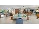 Spacious living room with mirrored walls, a ceiling fan, and ample seating at 4464 46Th S Ave, St Petersburg, FL 33711