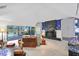 Bright living room boasts vaulted ceilings, fireplace, and water views at 4464 46Th S Ave, St Petersburg, FL 33711