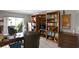 Well-lit office space featuring large bookshelves, a desk, and an outdoor view at 4464 46Th S Ave, St Petersburg, FL 33711