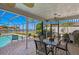 Screened-in patio with brick flooring, ceiling fan, and views of the canal at 4464 46Th S Ave, St Petersburg, FL 33711