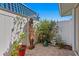 Private courtyard featuring brick pavers, potted plants, and a decorative statue at 4464 46Th S Ave, St Petersburg, FL 33711