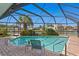 Screened pool area with brick pavers and view of the canal at 4464 46Th S Ave, St Petersburg, FL 33711