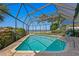 Screened-in pool with brick patio and view of the canal at 4464 46Th S Ave, St Petersburg, FL 33711