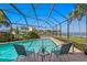 Relaxing screened-in pool area, with lounge chairs, and overlooking a scenic waterfront view at 4464 46Th S Ave, St Petersburg, FL 33711