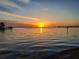 Beautiful sunset over the water reflecting the bright orange sky and the calm water at 4464 46Th S Ave, St Petersburg, FL 33711
