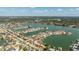 Expansive aerial view of a waterfront community, featuring homes with private docks and boat access to open waters at 448 79Th S St, St Petersburg, FL 33707