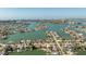 Scenic aerial view of a waterfront community boasting luxurious homes with private docks and stunning water views at 448 79Th S St, St Petersburg, FL 33707