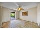 Bare bedroom with views of the backyard and window, and a ceiling fan at 448 79Th S St, St Petersburg, FL 33707