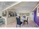 Open-concept dining room with tile floors opens to living spaces and kitchen at 448 79Th S St, St Petersburg, FL 33707