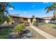 Exterior of the house, with a deck and patio, including beautiful foliage at 448 79Th S St, St Petersburg, FL 33707