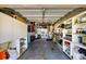 Organized garage with ample storage, a washer, and a dryer at 448 79Th S St, St Petersburg, FL 33707