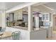 Modern kitchen featuring stainless steel appliances, stone countertops, and glass front cabinetry at 448 79Th S St, St Petersburg, FL 33707