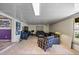 Cozy living room featuring tiled floors, comfortable seating, and a large screen television at 448 79Th S St, St Petersburg, FL 33707