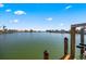 Scenic water view showcasing a serene waterway and residential waterfront properties at 448 79Th S St, St Petersburg, FL 33707