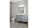 Contemporary bathroom featuring sleek vanity, modern fixtures, and glass enclosed shower at 4604 W Lowell Ave, Tampa, FL 33629