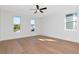 Bright bedroom with hardwood floors and multiple windows offering ample natural light at 4604 W Lowell Ave, Tampa, FL 33629