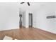 This bright bedroom features hardwood floors, a ceiling fan, and ensuite bathroom access at 4604 W Lowell Ave, Tampa, FL 33629