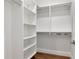 Walk-in closet with custom shelving, racks, and storage to maximize space at 4604 W Lowell Ave, Tampa, FL 33629