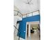 Open-concept foyer featuring a staircase with glass railings and view into the living room at 4604 W Lowell Ave, Tampa, FL 33629