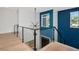 Second floor hallway showcasing modern railing and contemporary design at 4604 W Lowell Ave, Tampa, FL 33629