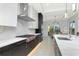 Bright kitchen featuring white marble countertops, stainless steel appliances, and a gas cooktop at 4604 W Lowell Ave, Tampa, FL 33629