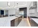 Modern kitchen with a large center island, stainless steel appliances, and an open layout at 4604 W Lowell Ave, Tampa, FL 33629
