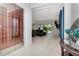 Open living area with a wine cellar and view to the backyard at 4604 W Lowell Ave, Tampa, FL 33629