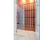 Sleek wine room with glass door and modern racking for storage at 4604 W Lowell Ave, Tampa, FL 33629