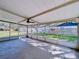 Screened patio with a ceiling fan and concrete floor at 5009 E Kirby St, Tampa, FL 33617