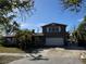 Charming two-story home with a two car garage, a stone accent and mature trees in a desirable neighborhood at 560 84Th Ave N, St Petersburg, FL 33702