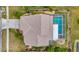 Aerial view of home featuring backyard pool, patio, and landscaped yard at 6208 Forrestal Dr, Tampa, FL 33625