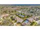 Community aerial view showcases lush greenery, ponds, and well-maintained homes at 6208 Forrestal Dr, Tampa, FL 33625