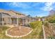 Beautiful backyard featuring a screened-in pool, hedges, and a manicured lawn at 6208 Forrestal Dr, Tampa, FL 33625
