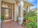 The front entrance features a beautiful brick floor and a newer model front door at 6208 Forrestal Dr, Tampa, FL 33625