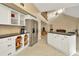 Spacious kitchen with white cabinets, granite counters, stainless steel appliances and access to the living area at 6208 Forrestal Dr, Tampa, FL 33625