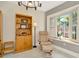 This living room is the perfect spot to relax with great natural light and a comfortable chair at 6208 Forrestal Dr, Tampa, FL 33625