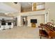 Spacious living area offering an open floor plan with views into the kitchen and an upstairs loft at 6208 Forrestal Dr, Tampa, FL 33625