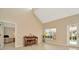 Living area with piano, view of the pool and access to the outdoor space at 6208 Forrestal Dr, Tampa, FL 33625
