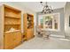 The living room area features tile floors, a bay window, and built in shelves at 6208 Forrestal Dr, Tampa, FL 33625