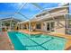 Sparkling screened-in swimming pool with sun-drenched patio and relaxing lounge chairs at 6208 Forrestal Dr, Tampa, FL 33625