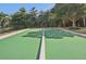 Well-maintained bocce ball court surrounded by lush landscaping at 624 Maraviya Blvd, Nokomis, FL 34275