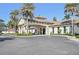 The luxurious community center at Toscana Isles with tiled roof and stone accents at 624 Maraviya Blvd, Nokomis, FL 34275